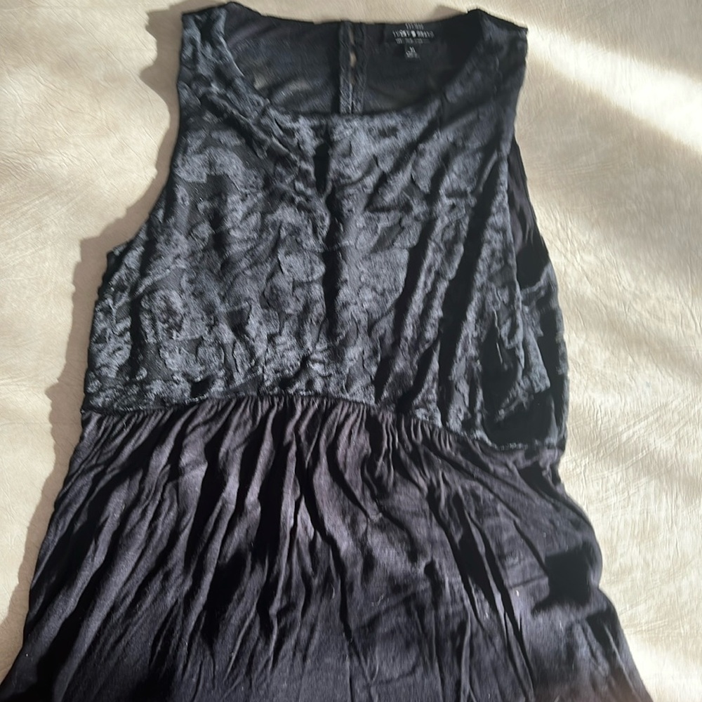 Black sleeveless waisted top